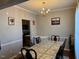 Traditional dining room with chandelier and dining table with six chairs at 5264 Patuxent Dr, Raleigh, NC 27616