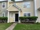 Inviting townhome with a well-manicured lawn and a clean, modern entrance at 5264 Patuxent Dr, Raleigh, NC 27616