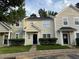 Charming townhomes featuring well-maintained landscaping and welcoming entrances at 5264 Patuxent Dr, Raleigh, NC 27616