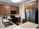 Efficient kitchen featuring stainless steel appliances and ample cabinet space at 5264 Patuxent Dr, Raleigh, NC 27616
