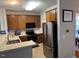 Functional kitchen layout featuring stainless steel refrigerator and appliances at 5264 Patuxent Dr, Raleigh, NC 27616
