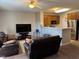 Open-concept living area with breakfast bar, stainless steel appliances and comfortable seating at 5264 Patuxent Dr, Raleigh, NC 27616