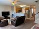 Cozy living room with an open floor plan to the kitchen, perfect for entertaining guests at 5264 Patuxent Dr, Raleigh, NC 27616