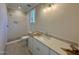 Bathroom featuring tile flooring, bright lighting, and a sleek glass-enclosed shower at 55 Cherry Bark Dr, Youngsville, NC 27596