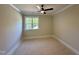 Comfortable bedroom with a ceiling fan and a window providing lots of natural light at 55 Cherry Bark Dr, Youngsville, NC 27596