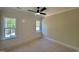 Bedroom featuring natural light, a ceiling fan, and paneled wall at 55 Cherry Bark Dr, Youngsville, NC 27596