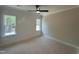 Bedroom featuring board and batten accent wall, and a large window with green exterior views at 55 Cherry Bark Dr, Youngsville, NC 27596