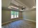 Neutral bedroom features tray ceilings, hardwood floors, a window, and recessed lighting at 55 Cherry Bark Dr, Youngsville, NC 27596