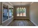 Bright dining area with large windows offering beautiful views and natural light at 55 Cherry Bark Dr, Youngsville, NC 27596