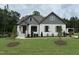 Charming single Gathering home with a landscaped front yard and a combination of brick and clapboard siding at 55 Cherry Bark Dr, Youngsville, NC 27596