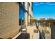 Condo balcony featuring patio furniture, glass railings, and scenic neighborhood views at 601 W Rosemary St # 403, Chapel Hill, NC 27516