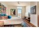 Cozy bedroom with an adjacent balcony, hardwood floors, and stylish decor at 601 W Rosemary St # 403, Chapel Hill, NC 27516