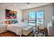 Bright bedroom featuring wood floors, large windows, and comfortable seating at 601 W Rosemary St # 403, Chapel Hill, NC 27516