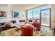 Bright living room features a wall of windows and comfortable seating at 601 W Rosemary St # 403, Chapel Hill, NC 27516