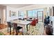 Inviting living space with floor to ceiling windows, stylish furniture, and tasteful decor at 601 W Rosemary St # 403, Chapel Hill, NC 27516