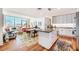 Bright open living room with a kitchen island, natural light, and stylish decor at 601 W Rosemary St # 403, Chapel Hill, NC 27516