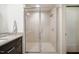 Modern glass-enclosed shower featuring bright tile and a showerhead at 601 W Rosemary St # 403, Chapel Hill, NC 27516