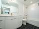 Clean bathroom boasts double vanity, bathtub, and stylish black tile at 615 W Peace St # 304, Raleigh, NC 27605