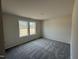 Bright bedroom featuring two windows offering natural light and neutral walls at 73 Phil Jack Rd, Dunn, NC 28334