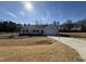 Charming one-story home features a manicured lawn and inviting front porch, with an attached two-car garage at 73 Phil Jack Rd, Dunn, NC 28334