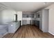 Kitchen featuring gray cabinets, stainless steel appliances, and hardwood flooring at 73 Phil Jack Rd, Dunn, NC 28334