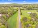 A wide aerial view of a rural area showcasing a long road amidst lush landscapes at 749 Bowden Rd, Chapel Hill, NC 27516