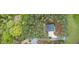 A picturesque aerial view of the home surrounded by dense trees and lush greenery at 749 Bowden Rd, Chapel Hill, NC 27516