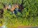Aerial view of a home surrounded by lush, green forest at 749 Bowden Rd, Chapel Hill, NC 27516