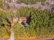 Bird's-eye view of a residence nestled in a dense forest with a private driveway at 749 Bowden Rd, Chapel Hill, NC 27516