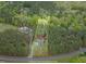 Aerial view of a home nestled amongst trees with an expansive lot outlined in yellow at 749 Bowden Rd, Chapel Hill, NC 27516
