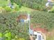 A captivating aerial view shows the home's proximity to wooded areas and a tranquil setting at 749 Bowden Rd, Chapel Hill, NC 27516