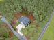 Aerial view of a home nestled among dense trees with a long driveway at 749 Bowden Rd, Chapel Hill, NC 27516