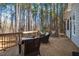 Spacious back deck providing ample seating and serene views of the surrounding woods at 749 Bowden Rd, Chapel Hill, NC 27516