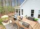 Expansive back deck includes seating, dining, and screened porch access, ideal for outdoor enjoyment at 749 Bowden Rd, Chapel Hill, NC 27516