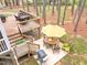 Backyard patio with a table, umbrella, outdoor furniture, and a grill at 749 Bowden Rd, Chapel Hill, NC 27516