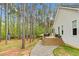 Home exterior shows well-maintained yard, mature trees, deck and patio space at 749 Bowden Rd, Chapel Hill, NC 27516