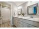 Bright bathroom featuring double vanities, white countertops, and modern fixtures at 749 Bowden Rd, Chapel Hill, NC 27516