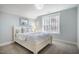 Bedroom with neutral paint, carpeted floors, and large windows at 749 Bowden Rd, Chapel Hill, NC 27516