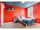 Bright bedroom with colorful accent wall and a comfy bed at 749 Bowden Rd, Chapel Hill, NC 27516