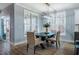 Dining room with wood table and seats for six with great natural light at 749 Bowden Rd, Chapel Hill, NC 27516