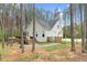 An exterior view of a home with a deck, patio, and fenced-in backyard at 749 Bowden Rd, Chapel Hill, NC 27516