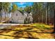 Charming two-story home with stone accents, a basketball hoop, and a well-manicured lawn at 749 Bowden Rd, Chapel Hill, NC 27516