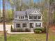 Exterior aerial showing manicured lawn and professional landscaping surrounding a beautiful two-story home at 749 Bowden Rd, Chapel Hill, NC 27516