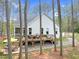 A beautiful home exterior showcases a deck, patio, and access to backyard at 749 Bowden Rd, Chapel Hill, NC 27516