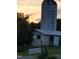 Quaint farm stand and silo at sunset, offering a glimpse of country charm at 749 Bowden Rd, Chapel Hill, NC 27516