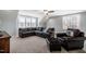 Bright living room featuring carpeted floors, a ceiling fan, and a comfortable sofa at 749 Bowden Rd, Chapel Hill, NC 27516