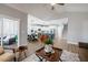 Open-concept living room with views to the kitchen, dining, and screened porch at 749 Bowden Rd, Chapel Hill, NC 27516