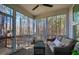 Relaxing screened porch featuring comfortable seating and serene views of the surrounding trees at 749 Bowden Rd, Chapel Hill, NC 27516