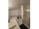 Bathroom features a jacuzzi-style tub, marble tile, and a shower stall at 88 Barnes Rd, Middlesex, NC 27557