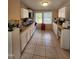 Functional kitchen with white cabinets, ample counter space, and lots of natural light from two large windows at 88 Barnes Rd, Middlesex, NC 27557